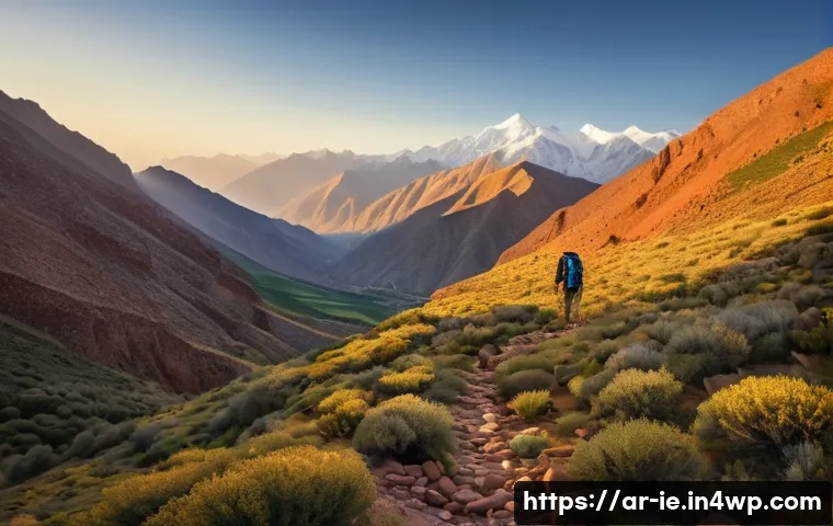 여행 중 영감을 주는 장소들 - A breathtaking scene of the Atlas Mountains at sunrise, featuring towering rocky peaks touching the ...